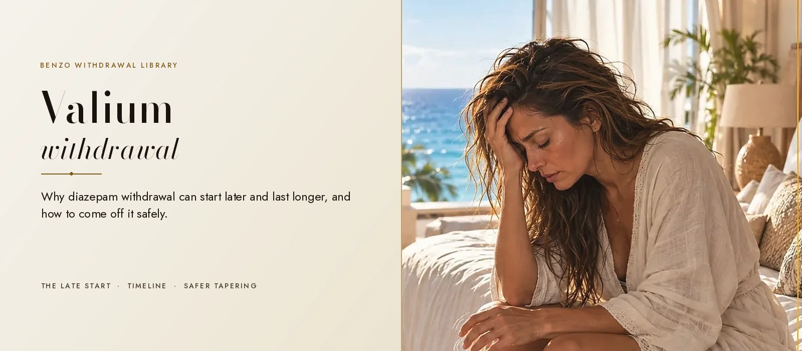 Woman sitting on the edge of a bed with her head in her hand during Valium withdrawal